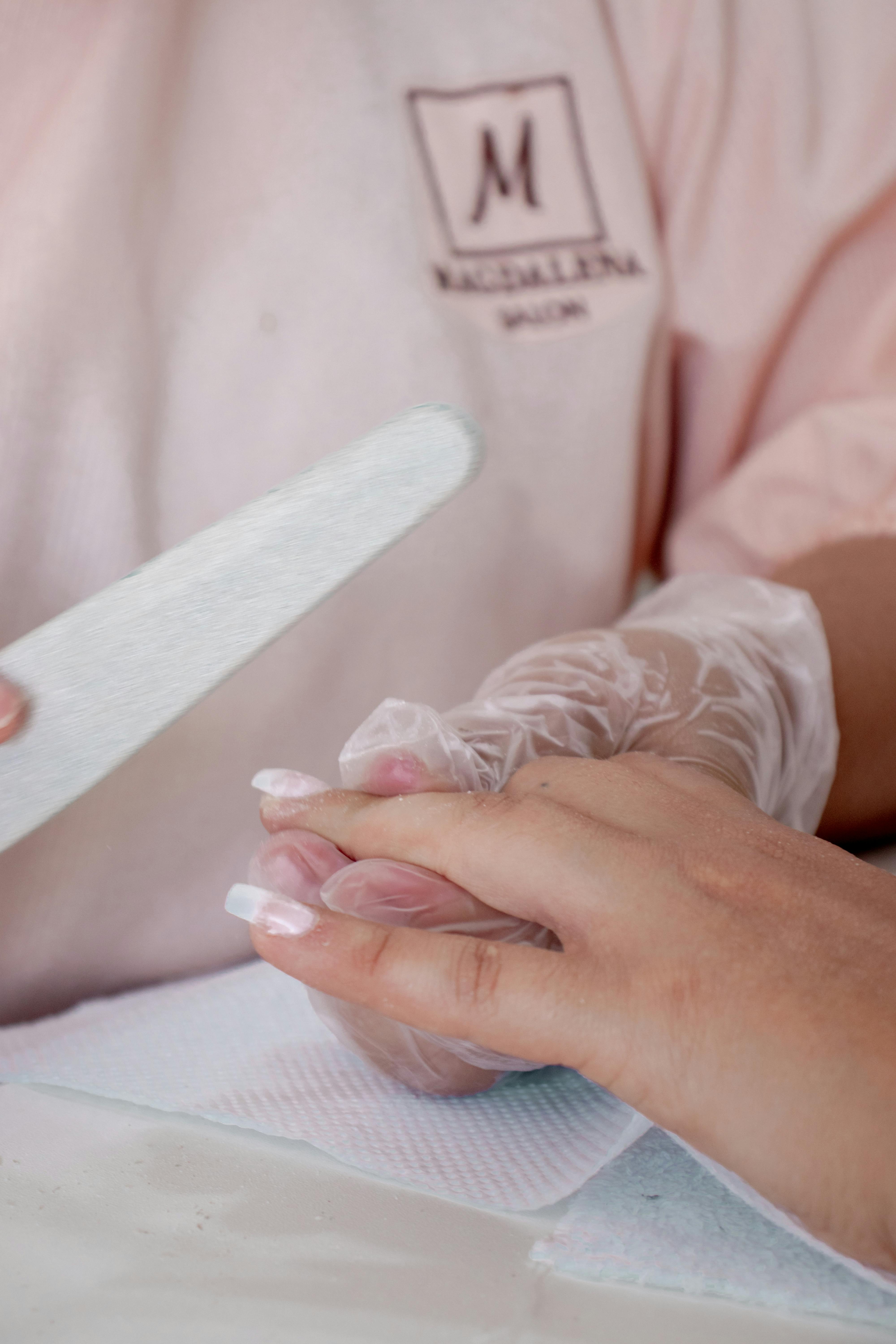 Detailed salon manicure treatment in progress